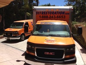Water Damage and Mold Removal Truck At Job Site